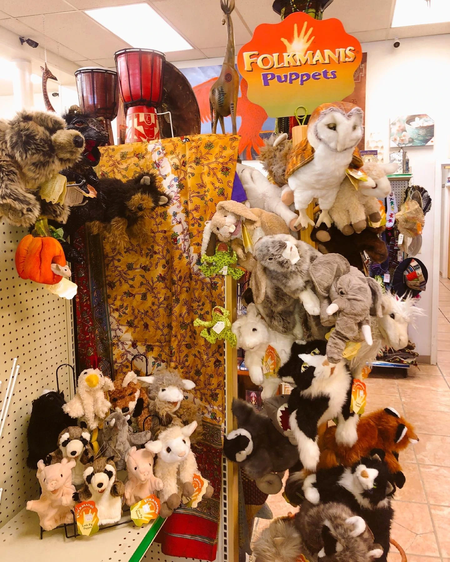 A display of stuffed animals and puppets