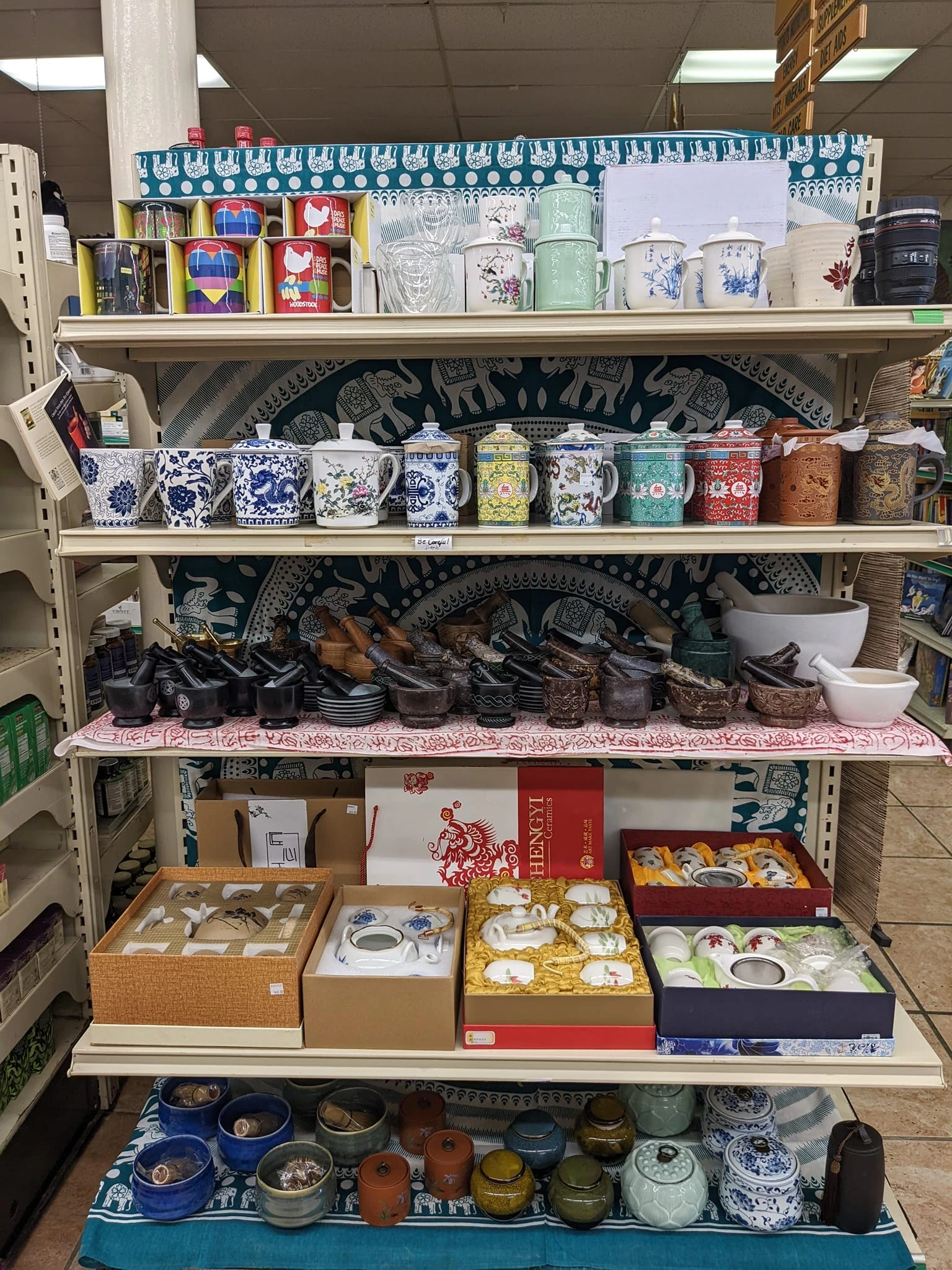 A shelf of teapots and other tea paraphernalia