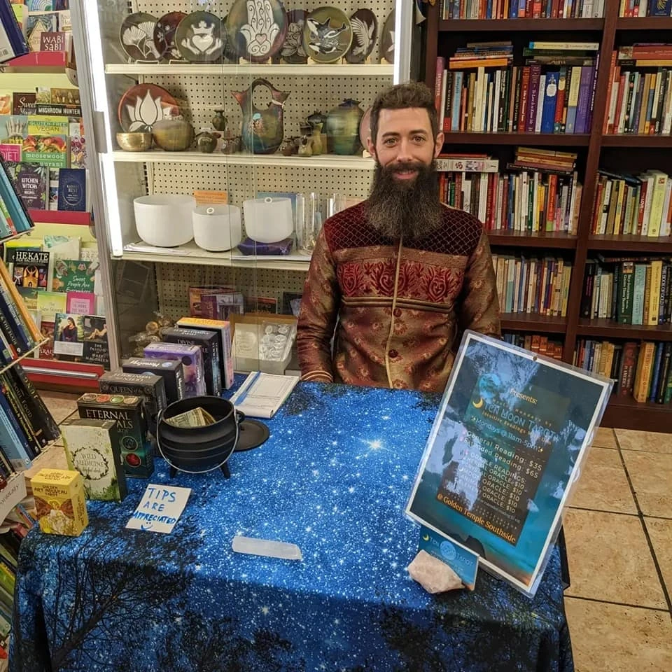 Dan seated with his tarot and oracle cards
